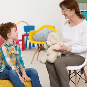 Speech therapist uses play-based techniques to support communication skills in children with childhood dysarthria